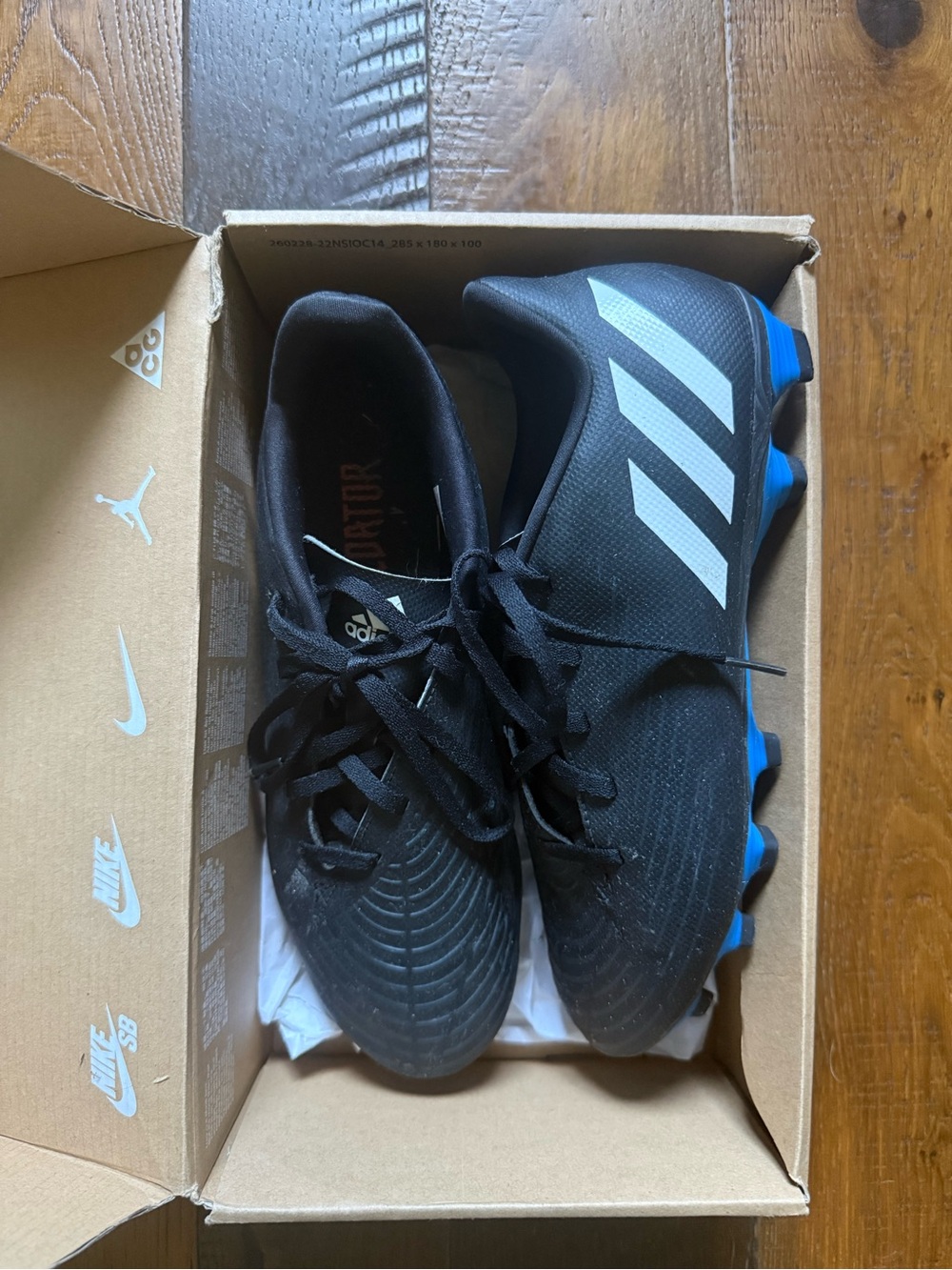 adidas Black Soccer Cleats with White Stripes and Blue Studs